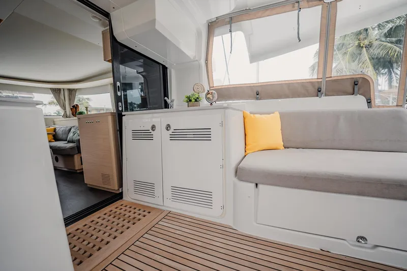  Yacht Photos Pics Interior of 2022 Lagoon 46 yacht with modern seating and wooden flooring.