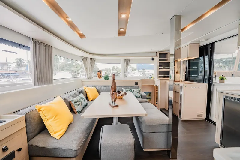  Yacht Photos Pics Luxurious interior of 2022 Lagoon 46 catamaran with modern seating and decor.