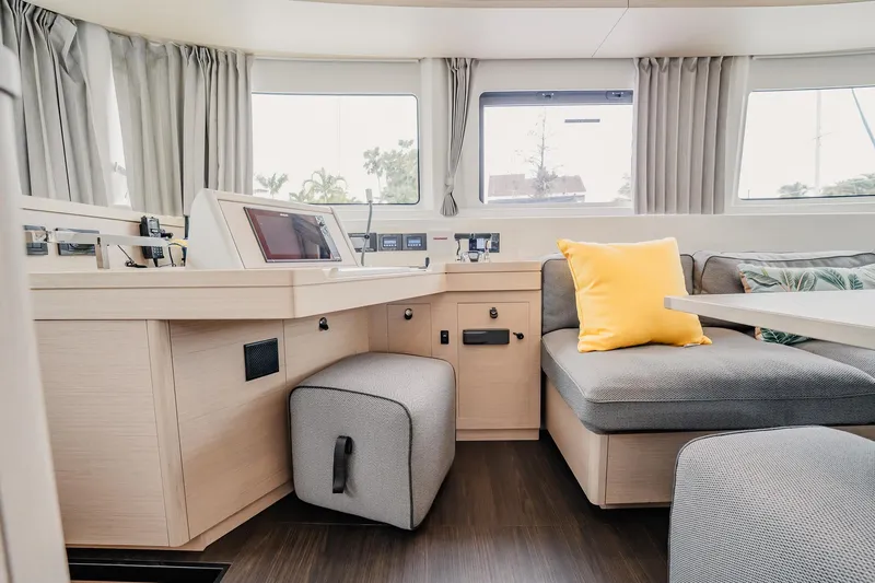  Yacht Photos Pics Interior of 2022 Lagoon 46 yacht with modern seating and navigation area.
