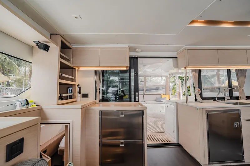  Yacht Photos Pics Modern interior of 2022 Lagoon 46 catamaran with sleek kitchen and spacious layout.