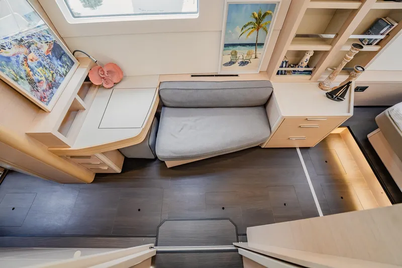  Yacht Photos Pics Luxurious interior of 2022 Lagoon 46 yacht with modern decor and cozy seating area.