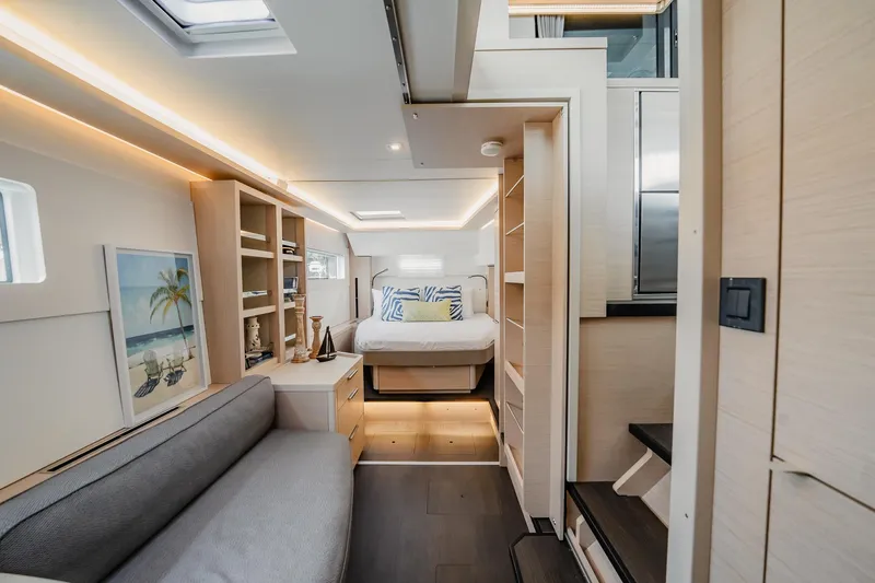  Yacht Photos Pics Luxurious interior of 2022 Lagoon 46 yacht with modern furnishings and cozy bedroom.