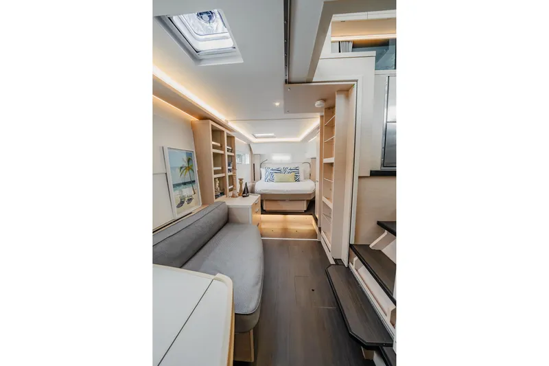  Yacht Photos Pics Luxurious interior of 2022 Lagoon 46 yacht with modern furnishings and ambient lighting.