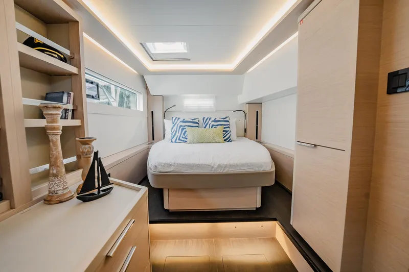  Yacht Photos Pics Luxurious interior of 2022 Lagoon 46 yacht with modern bedroom design.