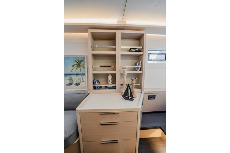  Yacht Photos Pics Interior of 2022 Lagoon 46 yacht with modern shelving and nautical decor.