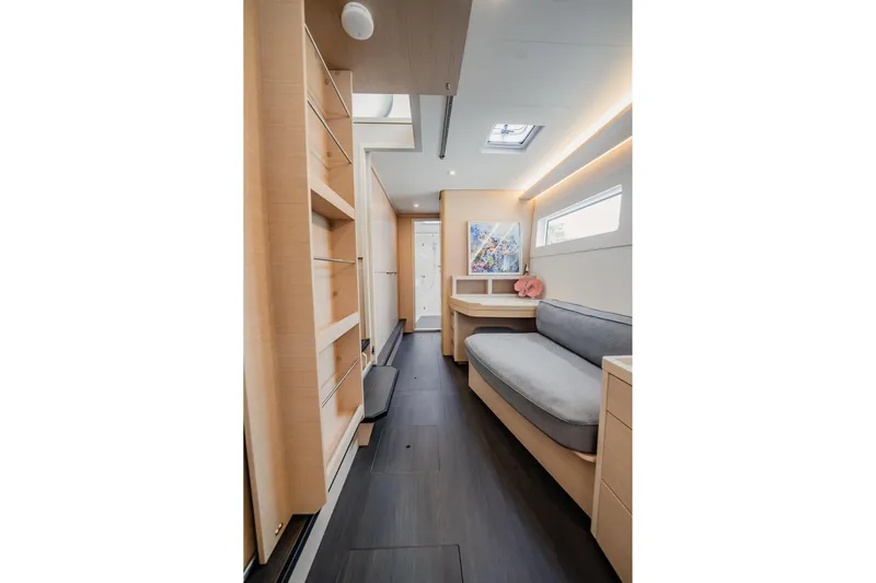  Yacht Photos Pics Interior of 2022 Lagoon 46 yacht, featuring modern design with light wood and cozy seating.
