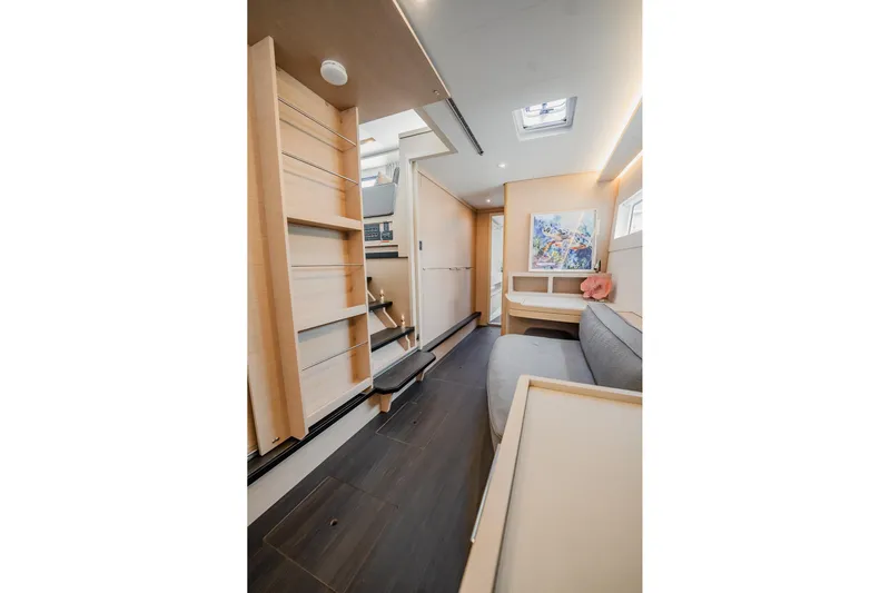  Yacht Photos Pics Luxurious interior of 2022 Lagoon 46 catamaran with modern design and cozy seating area.
