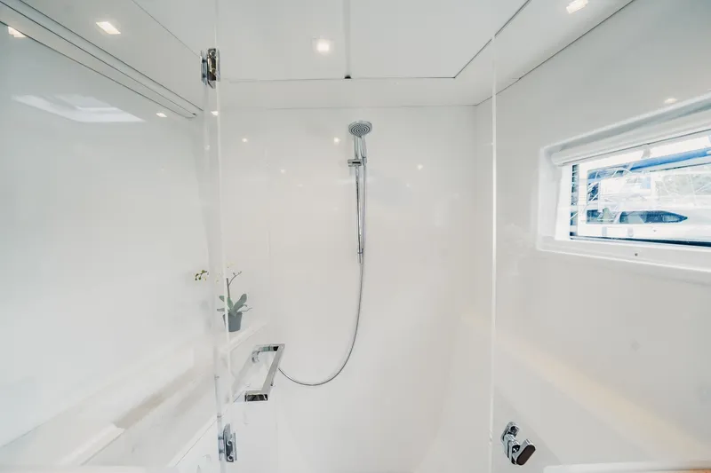  Yacht Photos Pics Modern shower in 2022 Lagoon 46 yacht, featuring sleek design and natural light.