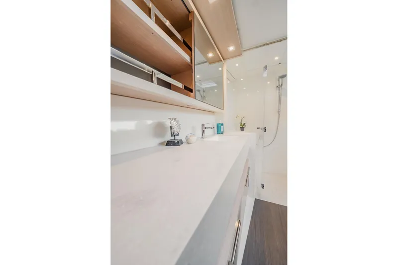  Yacht Photos Pics Modern bathroom interior on 2022 Lagoon 46 yacht, featuring sleek design and elegant fixtures.