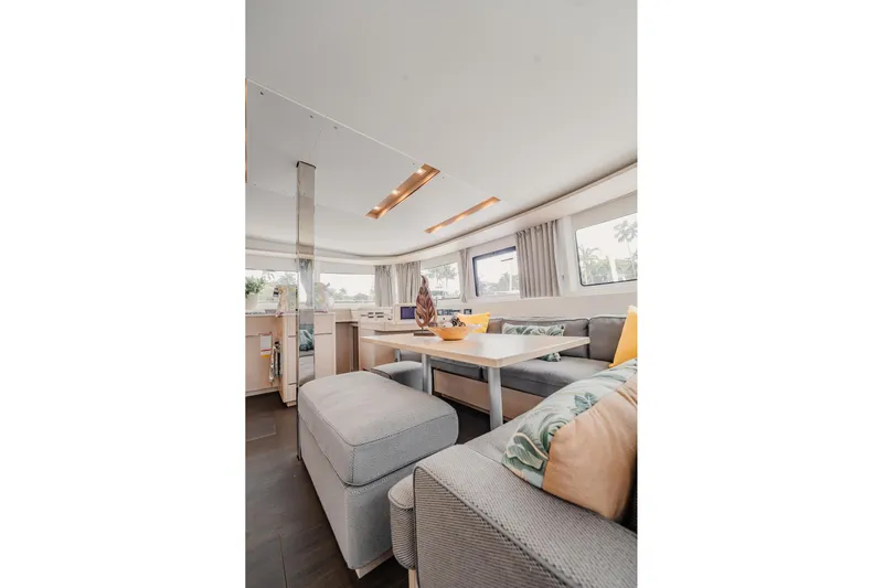  Yacht Photos Pics Luxurious interior of 2022 Lagoon 46 catamaran with modern seating and decor.