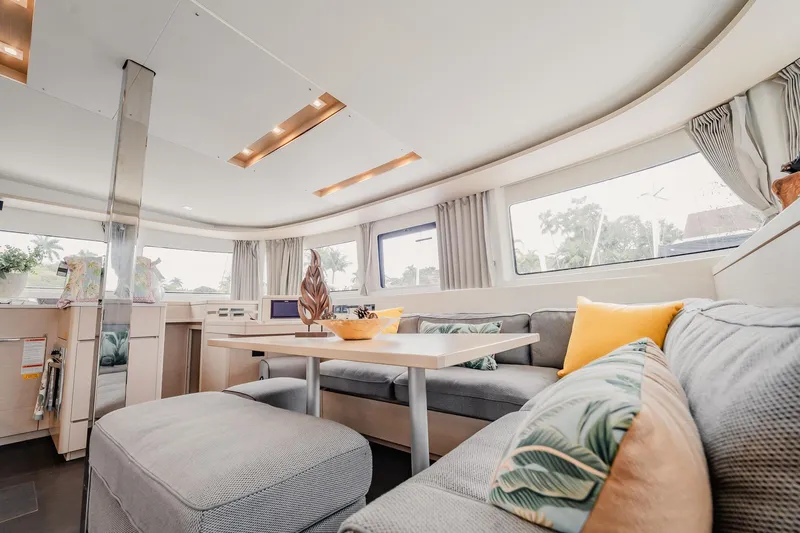  Yacht Photos Pics Luxurious interior of 2022 Lagoon 46 catamaran with modern seating and decor.