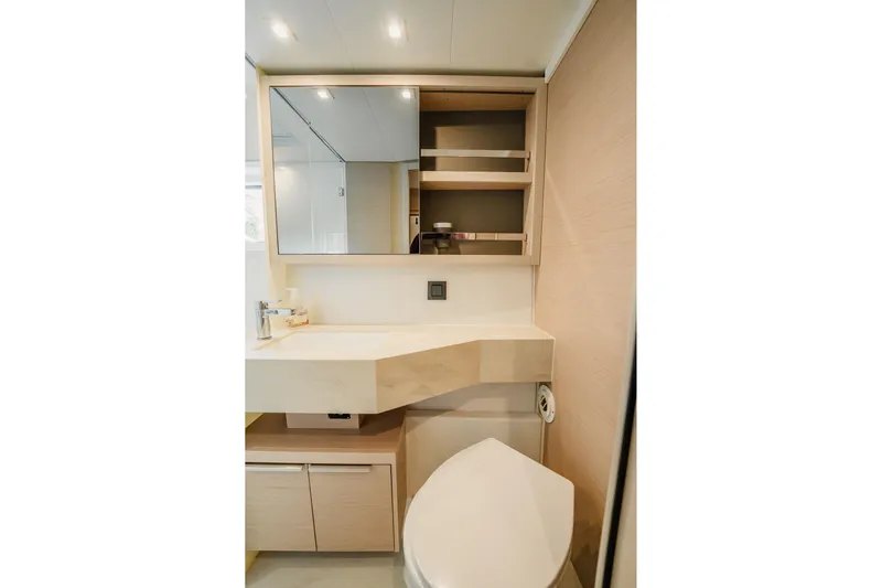  Yacht Photos Pics Modern bathroom interior of 2022 Lagoon 46 yacht with sleek fixtures and ample storage.