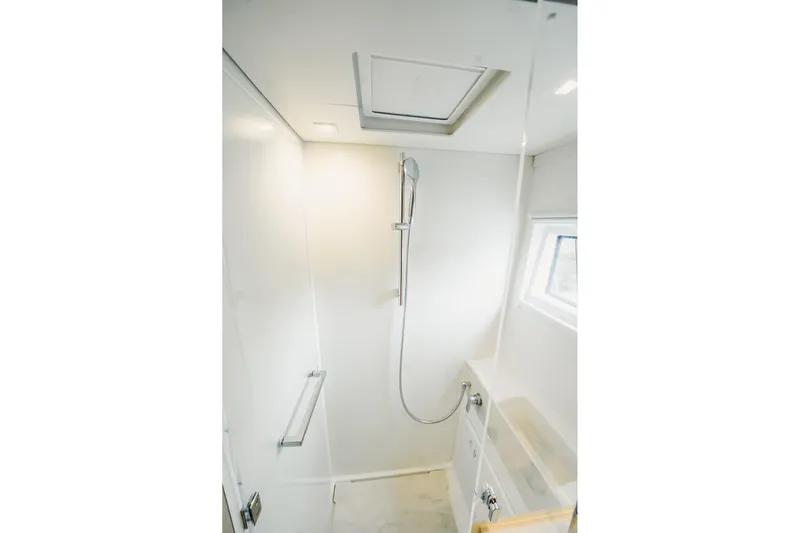  Yacht Photos Pics Modern shower area in 2022 Lagoon 46 yacht, featuring sleek design and natural lighting.