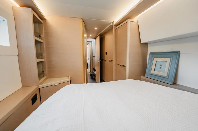  Yacht Photos Pics Luxurious interior of 2022 Lagoon 46 yacht cabin with modern decor and soft lighting.