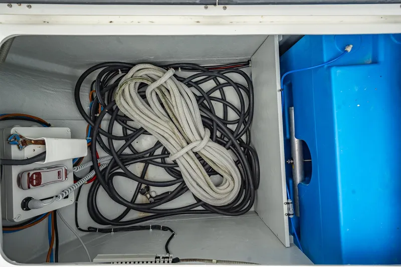  Yacht Photos Pics Storage compartment of 2022 Lagoon 46 yacht with ropes and cables.