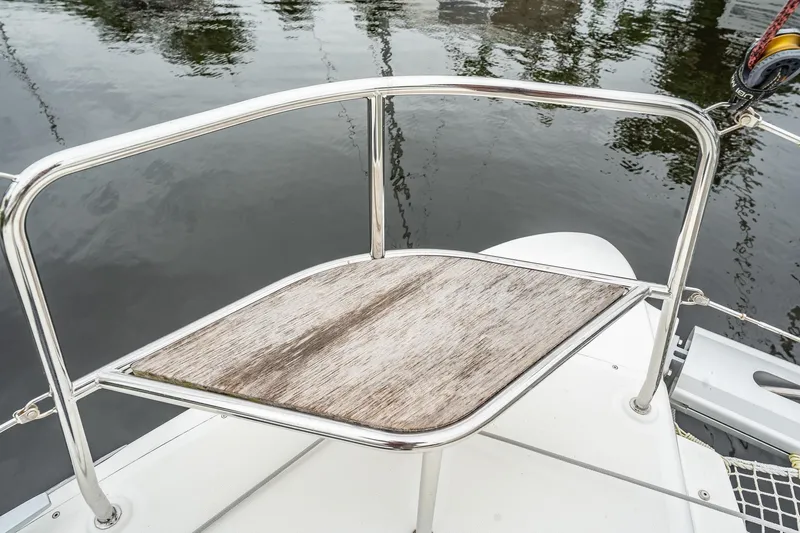  Yacht Photos Pics Deck detail of 2022 Lagoon 46 catamaran with stainless steel railing and wooden platform.