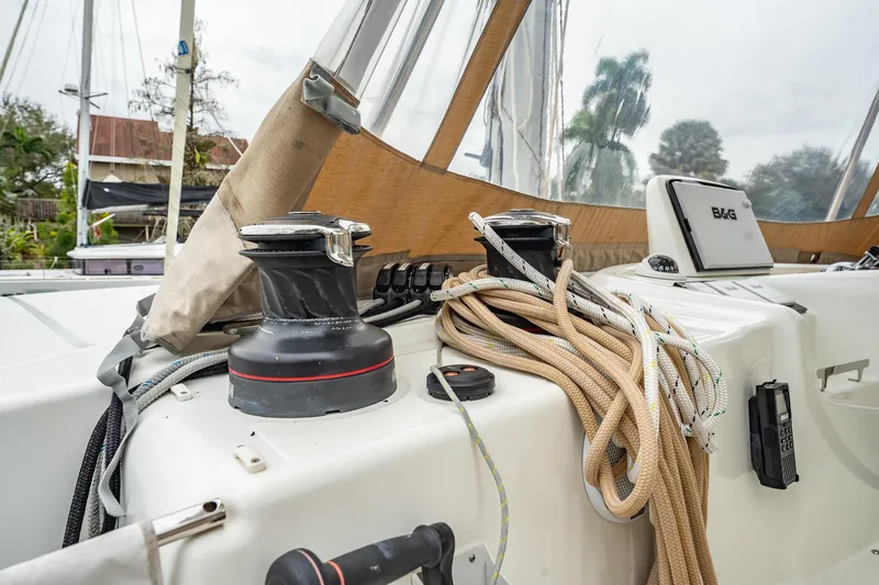  Yacht Photos Pics 2022 Lagoon 46 yacht deck with winches, ropes, and navigation equipment.