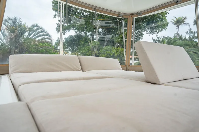  Yacht Photos Pics Luxurious interior of 2022 Lagoon 46 catamaran with plush seating and panoramic windows.