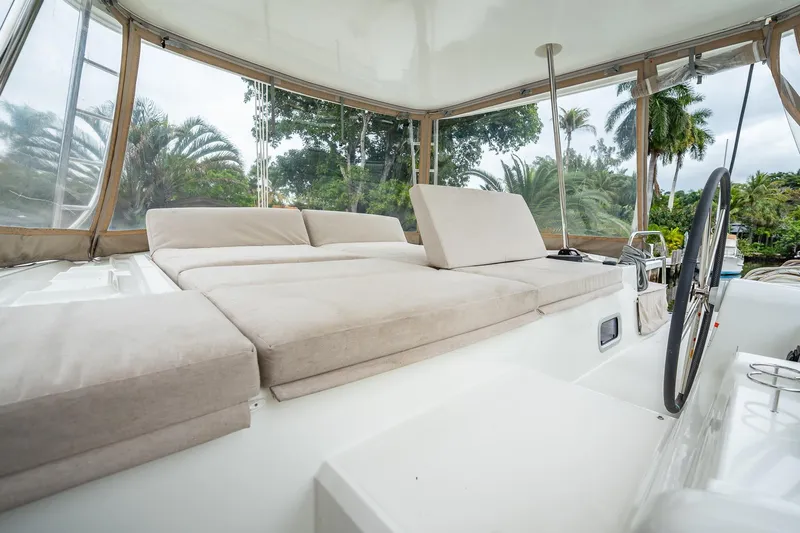  Yacht Photos Pics Luxurious 2022 Lagoon 46 yacht interior with plush seating and panoramic views.