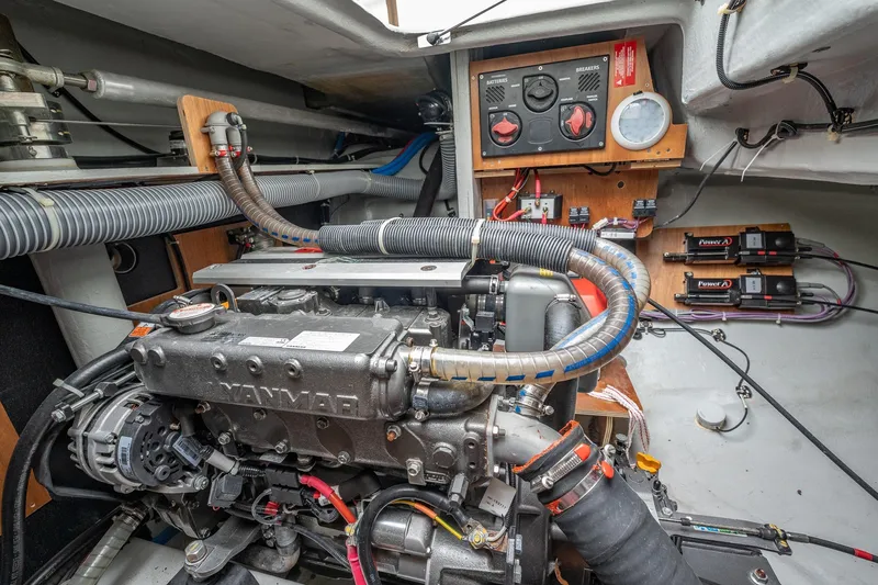  Yacht Photos Pics Engine room of a 2022 Lagoon 46 yacht, featuring a Yanmar engine and control panel.