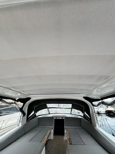 Blue Art Yacht Photos Pics 2023 Jeanneau 65 yacht interior with sleek seating and modern design.