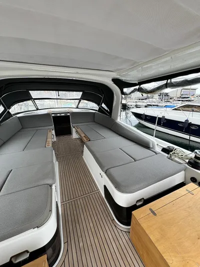 Blue Art Yacht Photos Pics 2023 Jeanneau 65 yacht interior with spacious seating and modern design.
