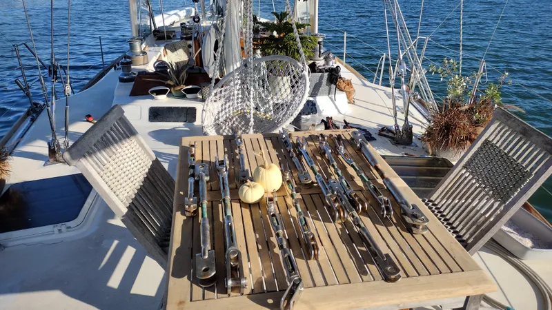Pacific High Yacht Photos Pics Sailing yacht deck with wooden table, tools, and small pumpkins, Custom 62 model, 1983.
