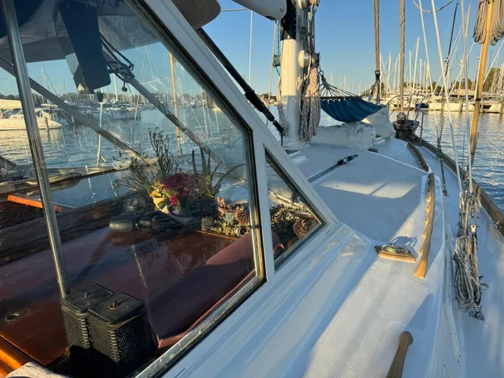 Pacific High Yacht Photos Pics Sailboat deck view with marina background, Custom 62 model, 1983.