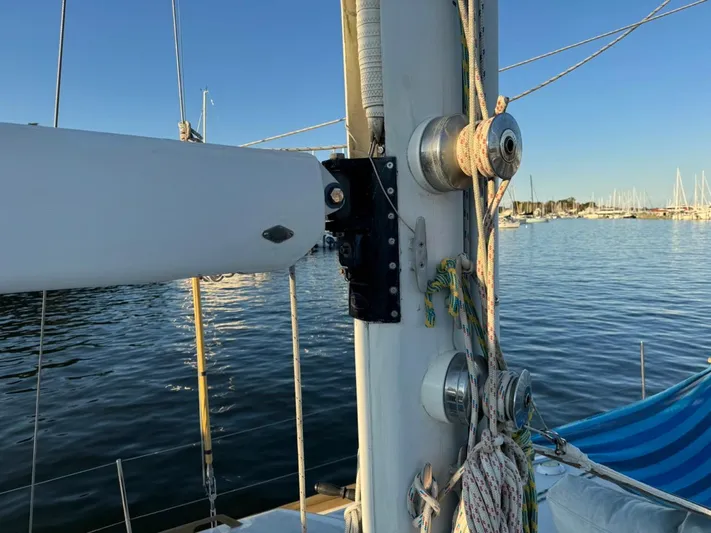 Pacific High Yacht Photos Pics Sailboat mast and rigging on a Custom 62, 1983, with marina in the background.