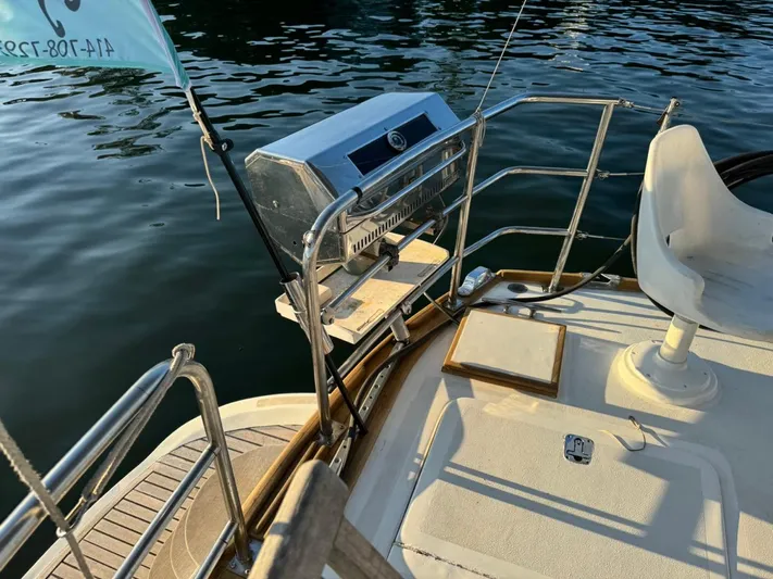 Pacific High Yacht Photos Pics Boat deck with grill, Custom 62 model, 1983, near water.