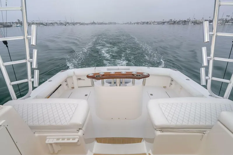 Show Time Yacht Photos Pics 2008 Cabo Yachts 38 EXPRESS boat deck with ocean view and fishing rod holders.