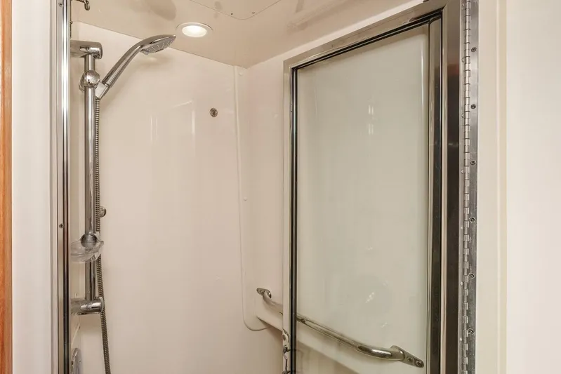 Show Time Yacht Photos Pics Shower area in 2008 Cabo Yachts 38 EXPRESS with sliding glass door.