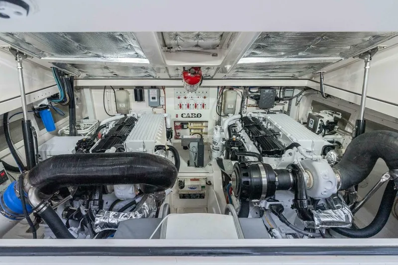 Show Time Yacht Photos Pics Engine room of 2008 Cabo Yachts 38 EXPRESS, showcasing dual engines and mechanical systems.