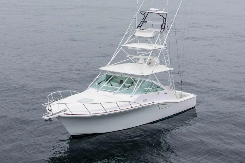 Show Time Yacht Photos Pics 2008 Cabo Yachts 38 EXPRESS on calm water, showcasing sleek design and fishing tower.