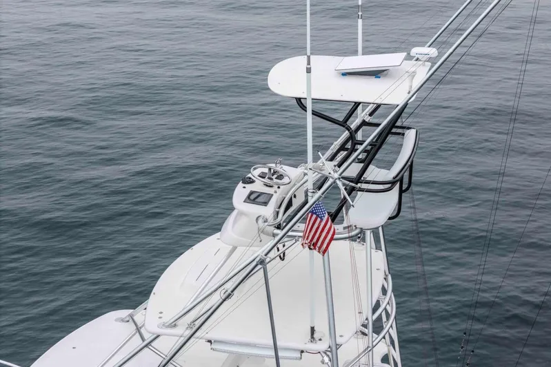 Show Time Yacht Photos Pics 2008 Cabo Yachts 38 EXPRESS tower with American flag over calm ocean.