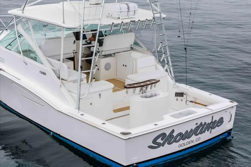 Show Time Yacht Photos Pics 2008 Cabo Yachts 38 EXPRESS boat on water, featuring spacious deck and fishing equipment.