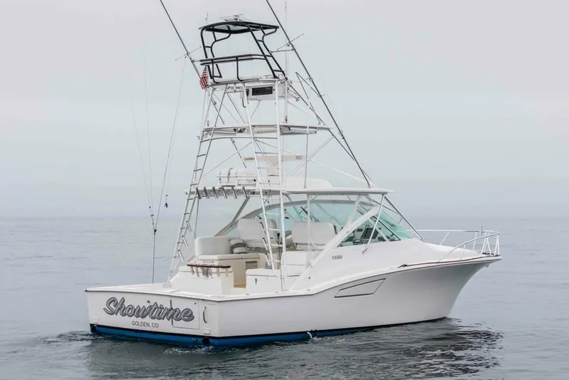 Show Time Yacht Photos Pics 2008 Cabo Yachts 38 EXPRESS boat on calm ocean waters.