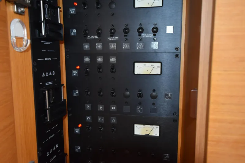 Lady Evelina Yacht Photos Pics Electrical control panel on a 2010 Jeanneau 57 yacht, featuring voltmeters and switches.