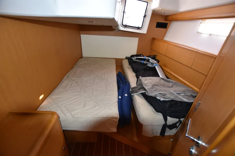 Lady Evelina Yacht Photos Pics Cozy cabin interior of 2010 Jeanneau 57 yacht with twin beds and storage.