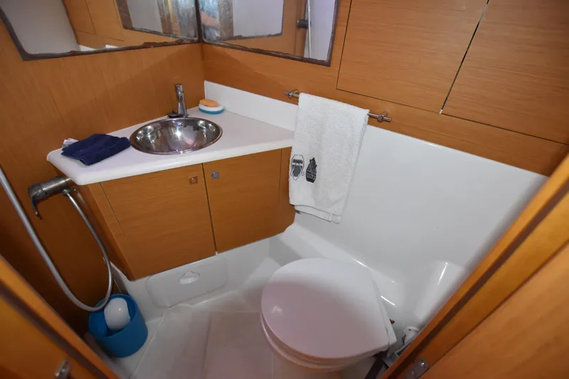 Lady Evelina Yacht Photos Pics Bathroom interior of 2010 Jeanneau 57 yacht with sink and toilet.