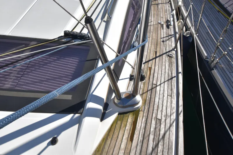Lady Evelina Yacht Photos Pics Deck view of 2010 Jeanneau 57 sailboat with wooden flooring and metal railings.