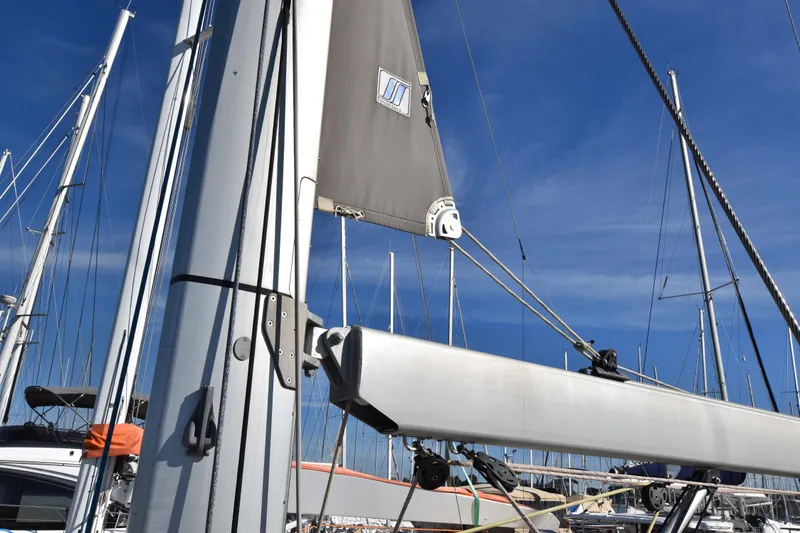 Lady Evelina Yacht Photos Pics Jeanneau 57 sailboat mast and rigging against a clear blue sky, 2010 model.