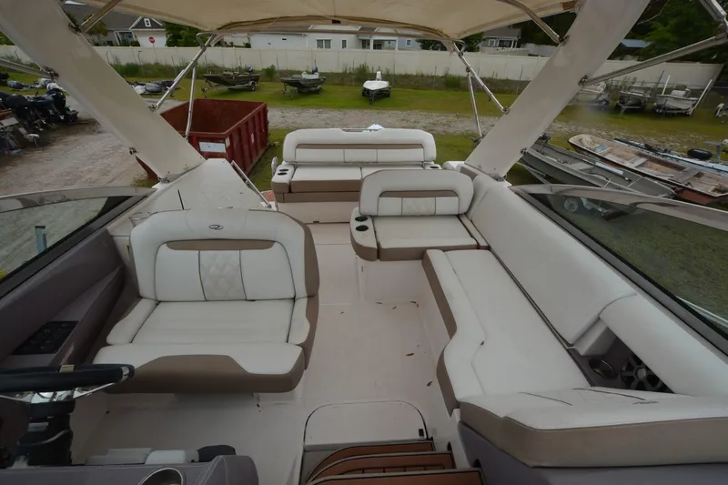 Mountaineer Mayhem Yacht Photos Pics 2018 Regal 33XO boat interior with spacious seating and modern design.