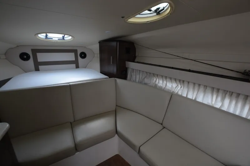 Mountaineer Mayhem Yacht Photos Pics Interior of 2018 Regal 33XO boat with seating and bed.