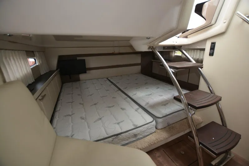 Mountaineer Mayhem Yacht Photos Pics Interior cabin of 2018 Regal 33XO boat with bed and ladder.