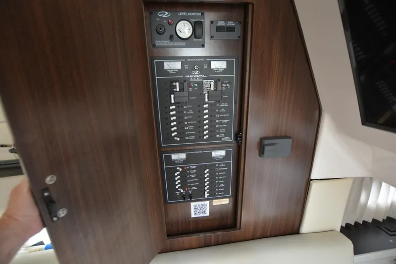 Mountaineer Mayhem Yacht Photos Pics Control panel inside a 2018 Regal 33XO boat, featuring various switches and gauges.