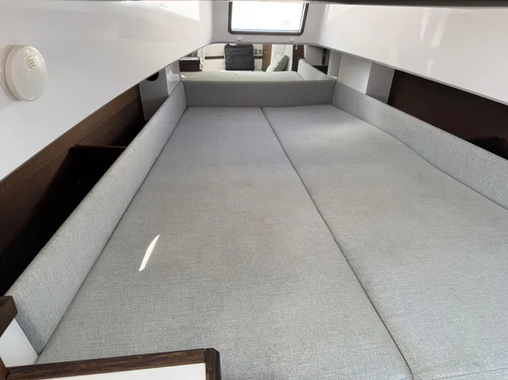 Meraki Yacht Photos Pics 2019 Axopar AX37XC cabin interior with spacious gray seating area.