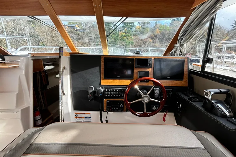  Yacht Photos Pics Interior of 2023 Cutwater C-32 Coupe boat, featuring modern helm and navigation equipment.