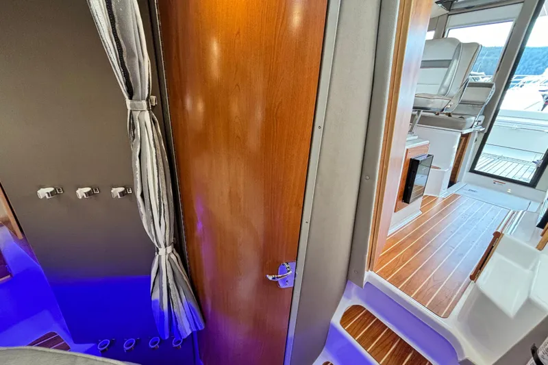 Yacht Photos Pics Interior of 2023 Cutwater C-32 Coupe boat, featuring wood finishes and modern design.