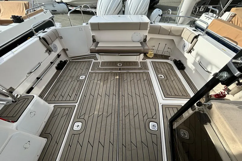  Yacht Photos Pics 2023 Cutwater C-32 Coupe boat deck with seating and storage compartments.